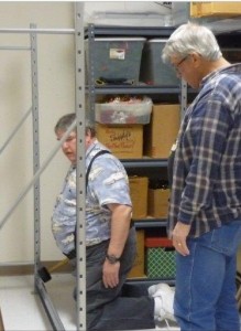 Steve Grissom and Jan Johnson assessing the progress on the heavy-duty storage racks they were installing during our Church Workday