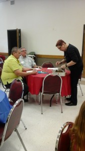 Steve and Don Trojacek help Judy Stallings with the table centerpiece before our Friendship Sunday festivities began.