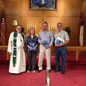 Pastor Ray receives new members, Cole and Amelia Hegeman and Don Trojacek during worship service on August 23.