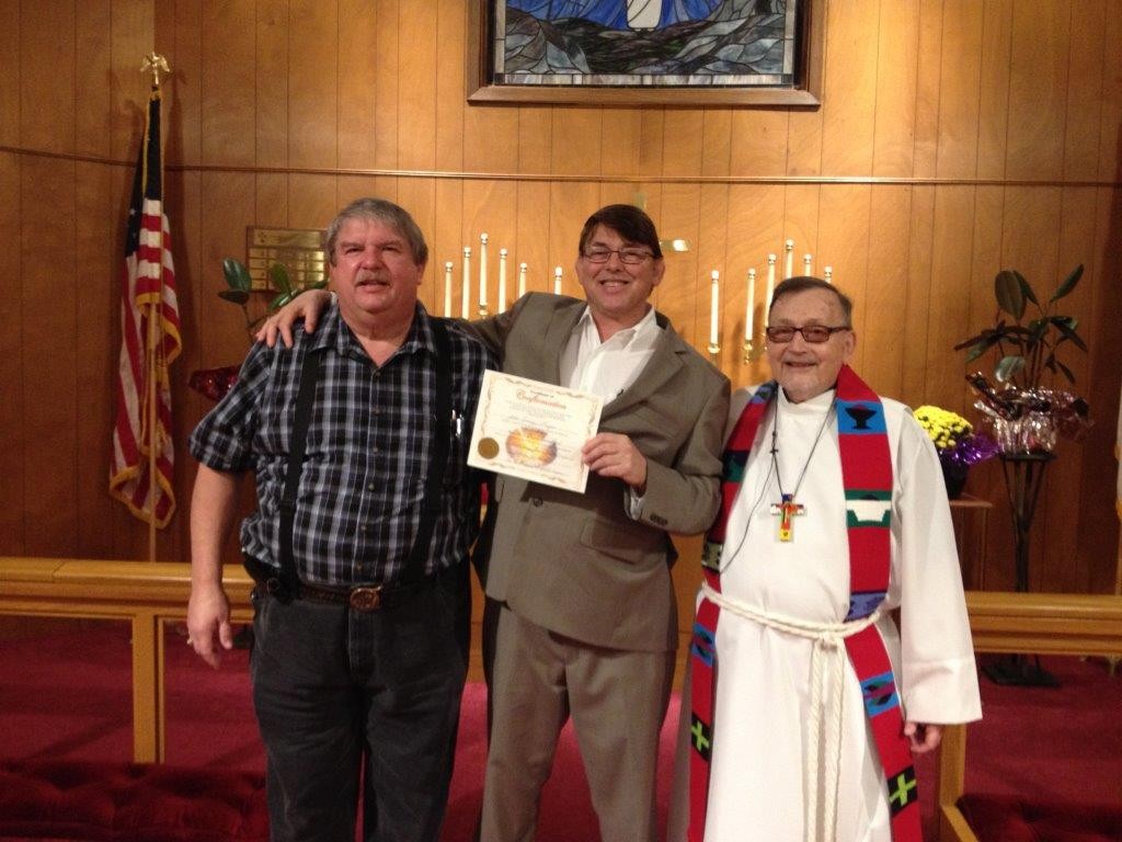 Head Elder Steve Grissom and Pastor Ray Spitzenberger welcome new member John Geiger (center) into communicant fellowship of our church on Reformation Sunday.
