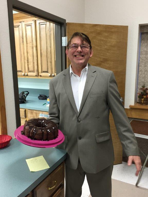 John Geiger, who joined St. Paul's on Reformation Sunday, is shown here with a special cake to honor the occasion.