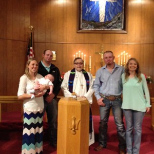 Parents Cole and Amelia Hegefeld with baby Bentlee, Left, Sponsors Clint Hegefeld and Amanda Nielson, Right, and Pastor Ray.