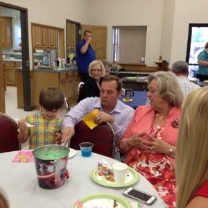 Caroline Osborne enjoying the Easter celebration at the church with her son, Robbie and grandson, Carter.