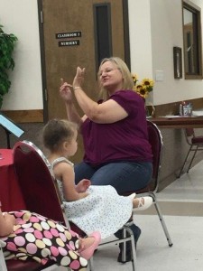 Guest Deaf Interpreter, Joanie Murdock, signing for us at Friendship Sunday (pictured with her granddaughter, Brooklyn.