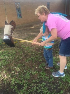 Cheryl Davis helping one of the children hit the piñata at our Friendship Sunday celebration.