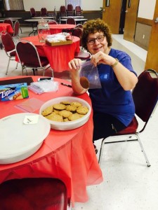 Peggy Spitzenberger is bagging  up cookies to be sold at the LWML Food Booth.